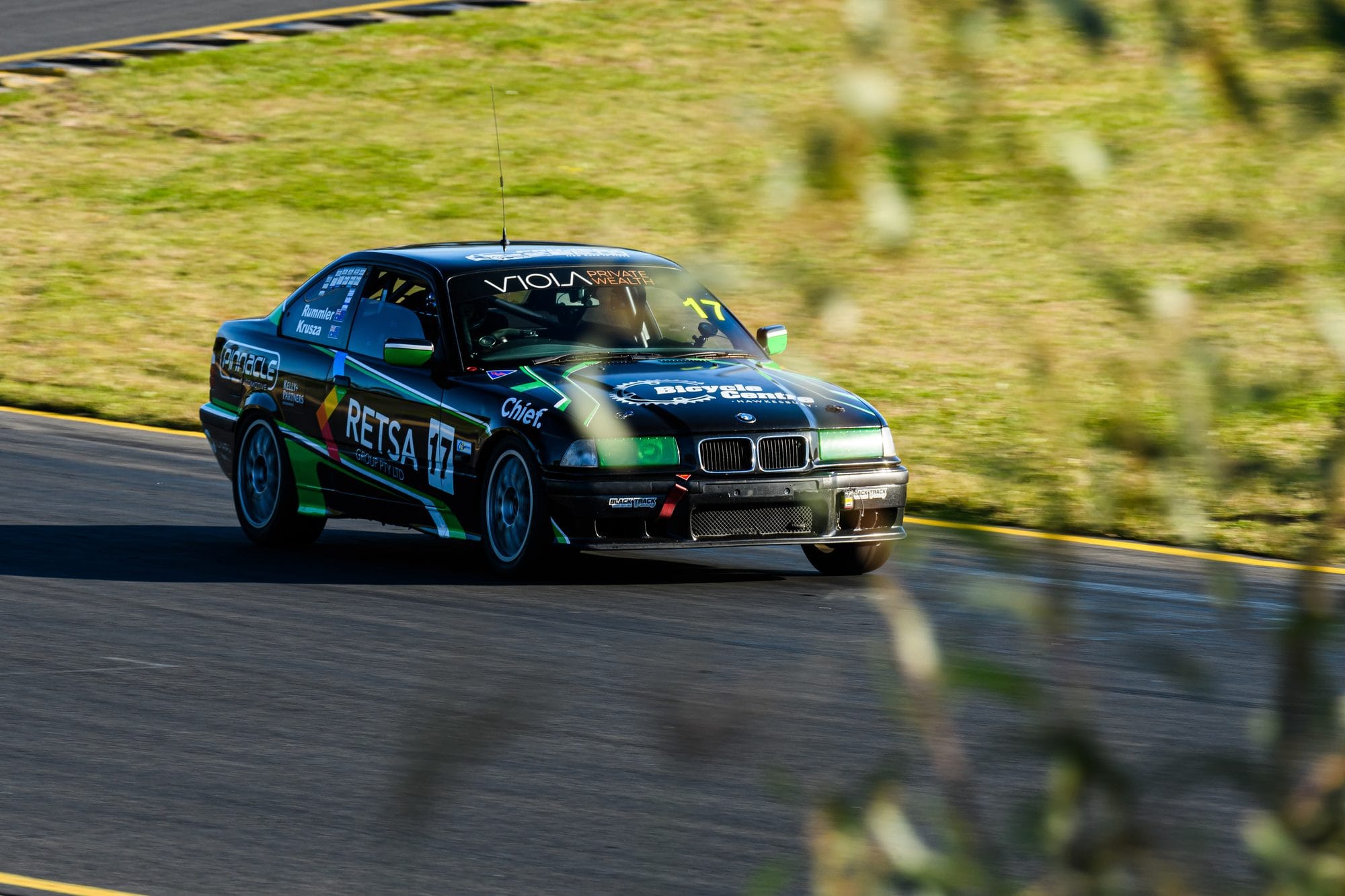 The #17 Project E36 BMW 328i cornering on track at Sydney Motorsport Park during MRA Round 5