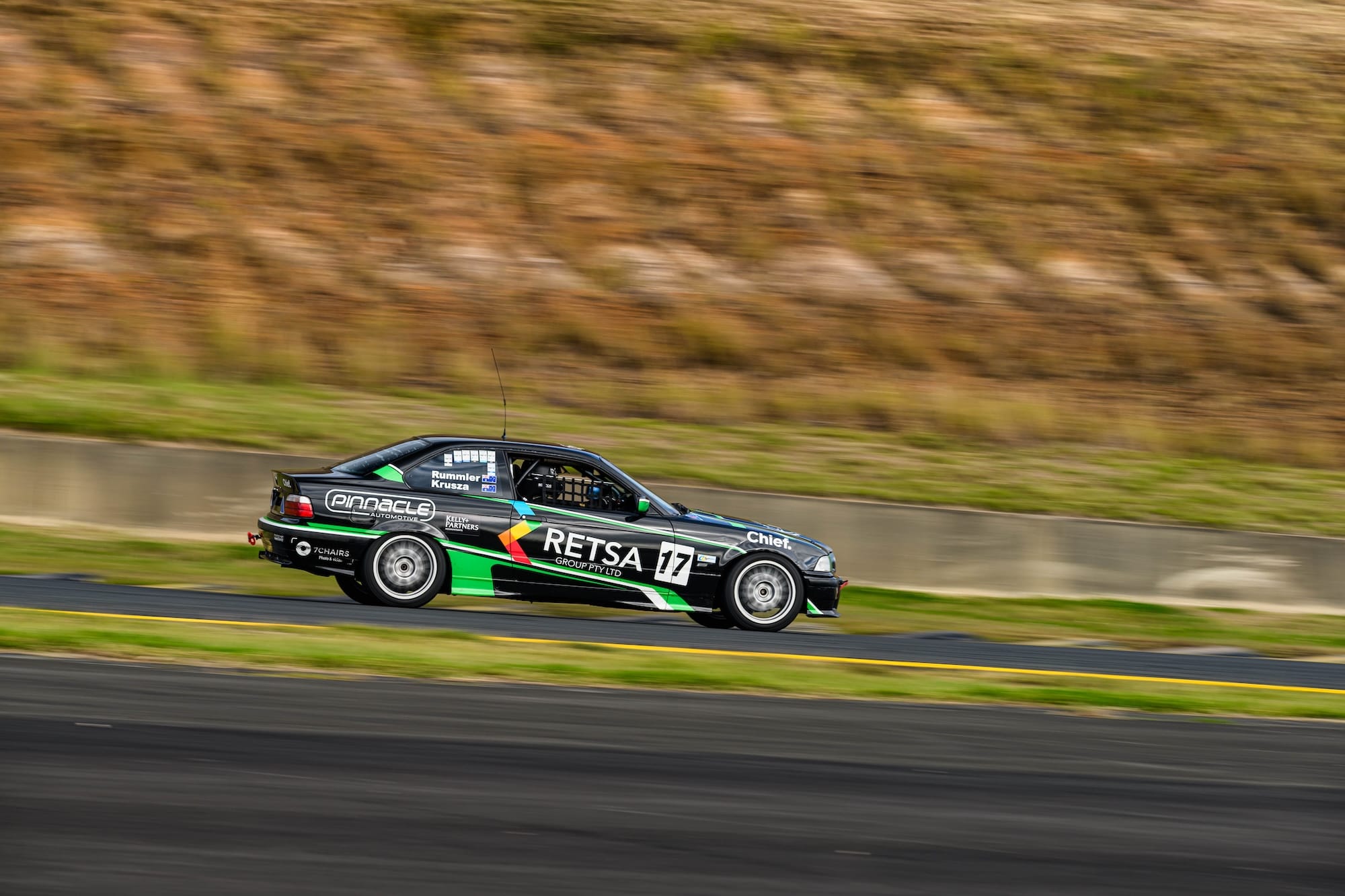 Side profile panning shot of the #17 Project E36 BMW 328i at speed at Sydney Motorsport Park during MRA Round 5